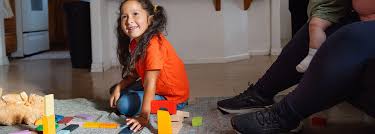 Child playing at home, representing family stability